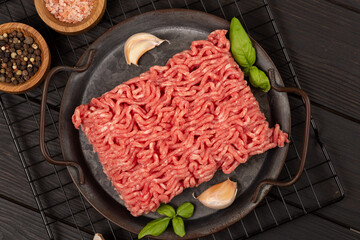 Raw homemade minced meat on a tin plate