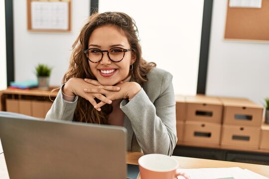 Young beautiful hispanic woman business worker using laptop working at office