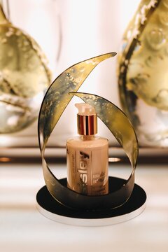 Beige tube of face foundation Sisley on a stand. The concept of decorative cosmetics for the face