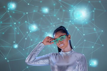 A model dressed as a robot wearing silver clothes and digital glasses, futuristic  clothes, with virtual icons . A future technology concept