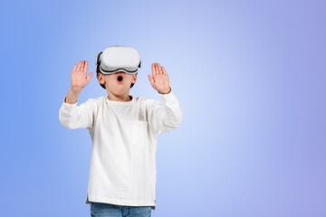 Boy wearing casual wear and vr googles touching metaverse realit - obrazy, fototapety, plakaty