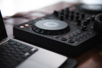 Close-up  dj controller and Sound mixing desk at home