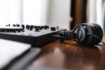 Obraz na płótnie Canvas Close-up dj controller and Sound mixing desk at home