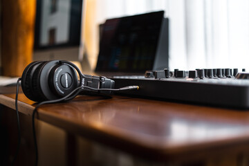 Obraz na płótnie Canvas Close-up dj controller and Sound mixing desk at home