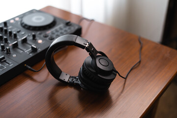 Close-up  dj controller and Sound mixing desk at home