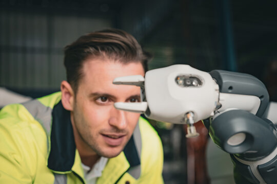 Engineer training skills with the new robotics machine in Factory