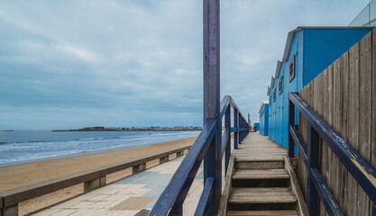 Naklejka premium wooden bridge on the beach