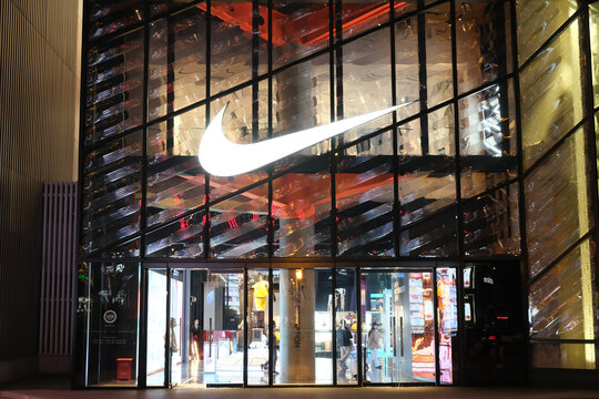 Shanghai,China-Oct. 23rd 2022: facade of large NIKE flagship store at night with brand logo