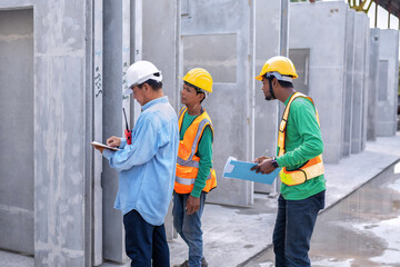 At building construction site supervisor check quality precast concrete panel before installation