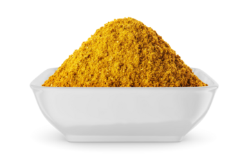 Curry powder in round bowl isolated on white. Front view.