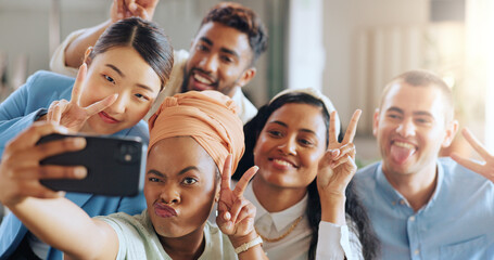 Phone selfie, peace sign and business team in startup office of creative marketing agency. Teamwork, diversity and happy men and women smile for crazy photo on smartphone in modern office.