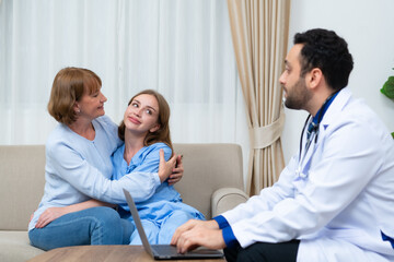 Obraz premium Her mother and the doctor had a conversation about the daughter's severe illness. to be informed of the treatment's status and future treatment options