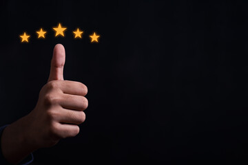 Close up of man customer giving a five star rating. Using technology for Review, Service rating, satisfaction, Customer service experience and satisfaction survey concept.