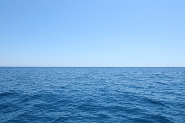 The front view in the morning sky is bright blue with clear white clouds. And the ocean deep indigo...