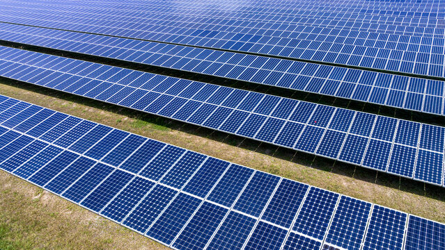  Blue Solar panel farm or solar power plantation.  Alternative renewable energy with photovoltaic cell industry. Green energy technology for future world concept,