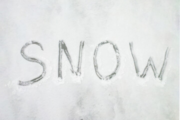 Snow-covered background with the word snow