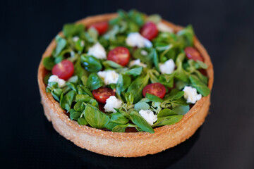 Cake of vegetables lying on the white background. Healthy cooking concept