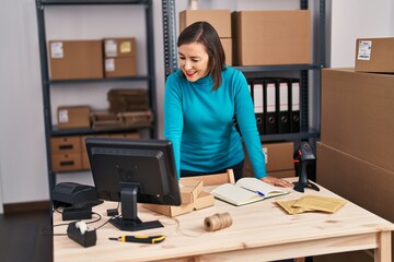 Middle age woman ecommerce business worker standing at office