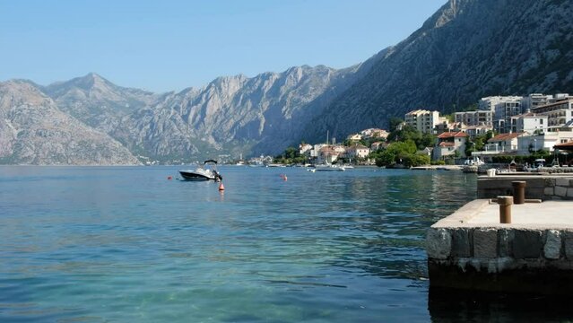 Boat in Kotor bay, view of Kotor bay from Dobrota, Montenegro, horizontal video.