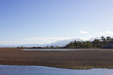 Beach with mountains behind