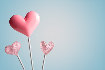Fototapeta na wymiar three Pink Valentine's day heart shape lollipop candy on empty pastel paper background. Love Concept