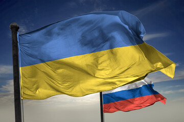 Ukraine and Russia flag is waving in front of blue sky