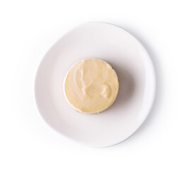 Lemon meringue tart on white plate top view