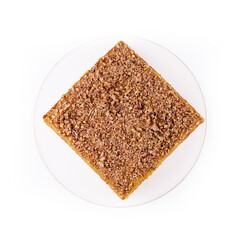 Walnut cake, nuts on white plate