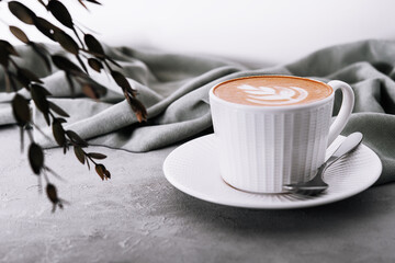Close up of Cup of coffee with heart flower painted on foam