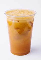 Iced caramel coffee covered with whipped cream in plastic glass