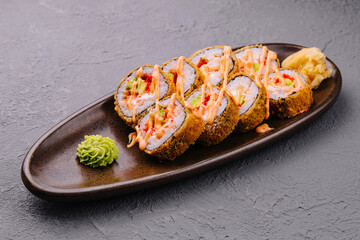 set of tempura fried sushi rolls on plate