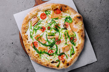 Delicious gourmet pizza with salmon and seaweed