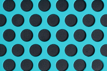 Bright turquoise background with round, black cells shape honeycombs.