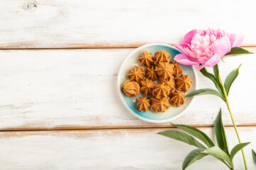 Homemade soft caramel fudge candies on white wooden, top view, copy space.