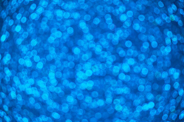 Abstract blue background with round bokeh.