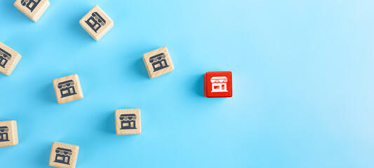 Franchise Business concept, Wooden cubes with franchise icons on blue background. copy space