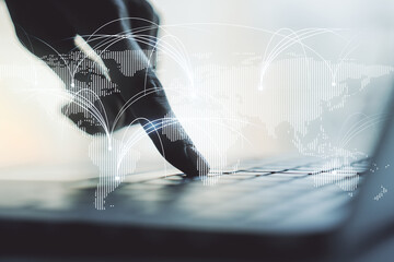 Double exposure of abstract digital world map with connections and hands typing on laptop on background, research and strategy concept