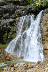 Obraz premium The waterfall in the tropical mountains.