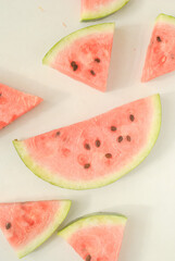 slices of watermelon on a white background 