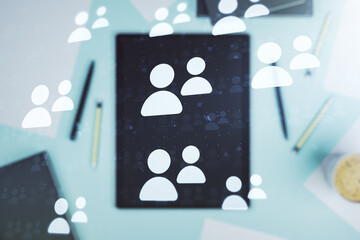 Double exposure of social network icons concept and modern digital tablet on background. Networking concept