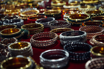 Women's jewelry, bracelets at the night market in Goa, India. Background of jewelry