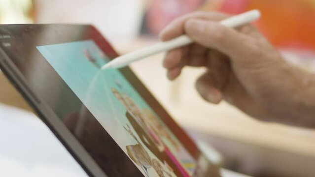 Close up Apple Pencil on iPad to create digital artwork and drawing