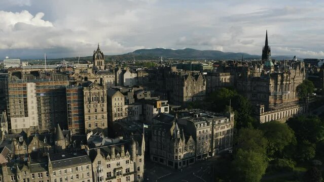 Aerial view of Edinburgh's downtown historic buildings at sunset.