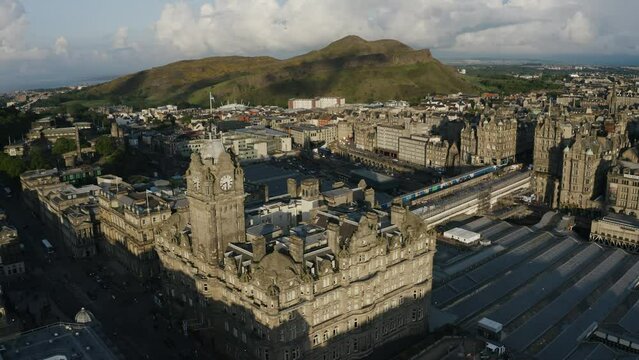 Aerial view of Edinburgh, Scotland featuring The Balmoral, Waverley Train Station, and Calton Hill.