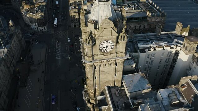 Rising aerial view of The Balmoral hotel near the Waverley Train Station is Edinburgh, Scotland.