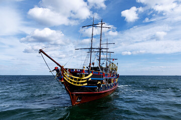 An old wooden sail ship at the sea.