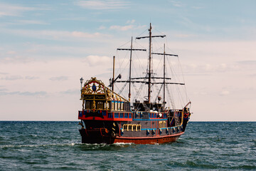 An old wooden sail ship at the sea.