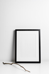 Black portrait frame mockup with copy space for artwork, photo, painting or print presentation