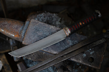 tanto blade with hamon line on anvil