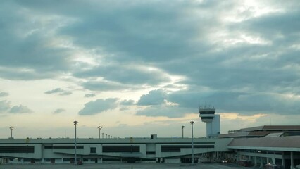 sunset sky view with some cloudy above the plane parking area of airport without any airplane